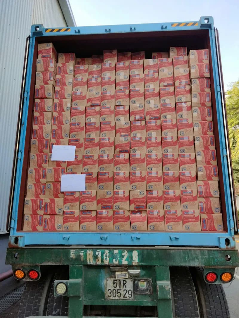 Indomie cartons loaded into a shipping container for distribution