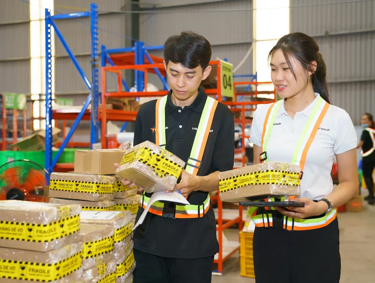SwiftHub team members checking products together in the warehouse